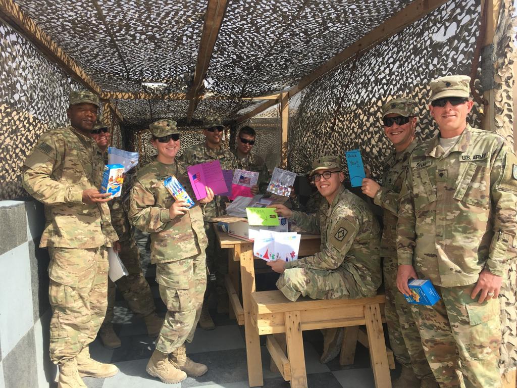 Hello! Attached is a photo of soldiers in my unit opening packages received from Arlington Heights in Chicago. The package was addressed to our Executive Officer, 1LT Joseph DiBartolomeo.
