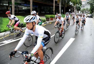Photos: Photo A Cyclists on their