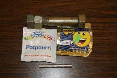 A subsequent search revealed a six inch hollow bolt and an empty packet of