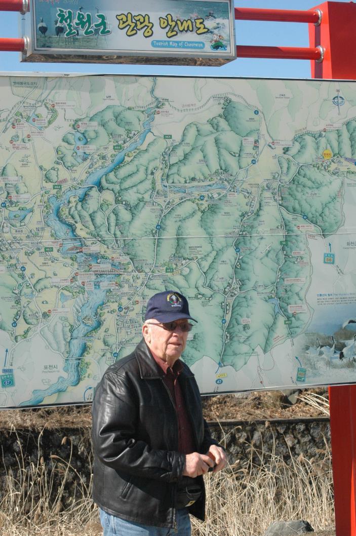 This was his first visit to the country since he fought here in 1953-1954. Photo by Jason Chudy Wayne Mitchell stands in front of a tourist map near Yangjiri, Republic of Korea, March 10.