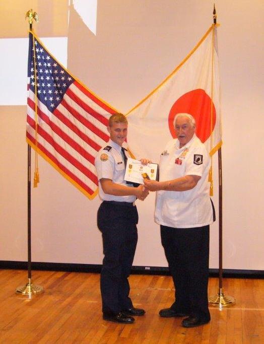 Commander Provencher presenting a VFW Award to one of the outstanding Cadets at an awards ceremony