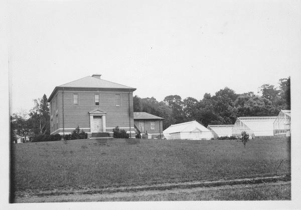 French Hall at left, French Hall Greenhouse at right, view northeast, no date (between 1909 and 1918) Courtesy