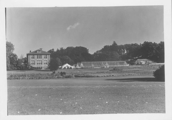 French Hall at left, French Hall Greenhouse at right, view north, no date (early 20 th century, showing the extension and reconstruction of French Hall