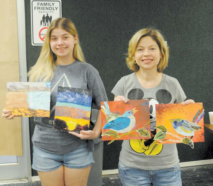 Kukkola, left, stand with their artwork during the Mixed Media Collage class at the Fort  Value