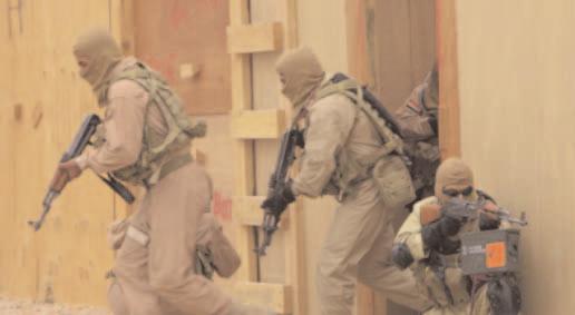 I R A Q W A R S P E C I A L R E P O R T May 2005. An Iraqi SWAT team from the city of al-hillah clears a building during a demonstration at Forward Operating Base Kalsu. U.S. Army Lt.