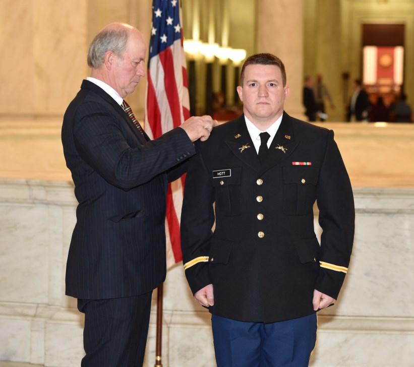His Second Lieutenant Rank was pinned on by his father, Bradley Hott.