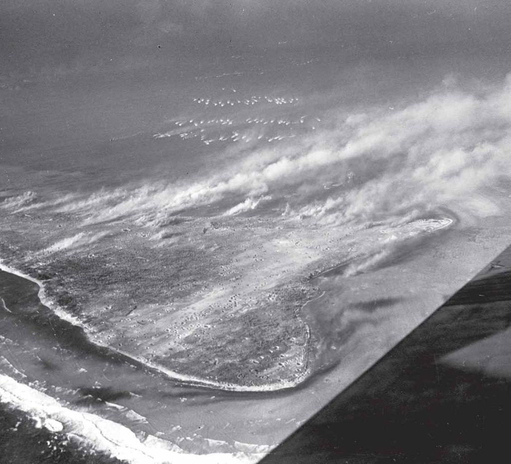 As three assault waves of Marines approach Engebi s southwest coast in army amtracs, the final pre-landing bombardment strikes the island. Note the immense number of shell craters throughout Engebi.