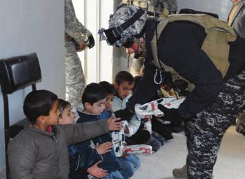 of western Mosul, Iraq, Jan. 13. Young children lined up with smiles on their faces as they discovered the gifts brought for them by Soldiers and Iraqi Policemen.