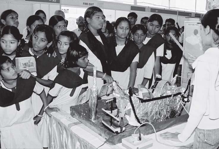 A participant explaining about her model at the 33rd JNNSEC to the visiting students of Raman effect by the great Indian physicist Sir C.V. Raman on this day in 1928.