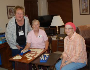 Sister Janet Ryan, center, in Chicago with friends at the Art Exhibition an 8th Day Center for Justice fundraiser held in September and sponsored by the Sisters of St. Francis. Sister Ruth E.
