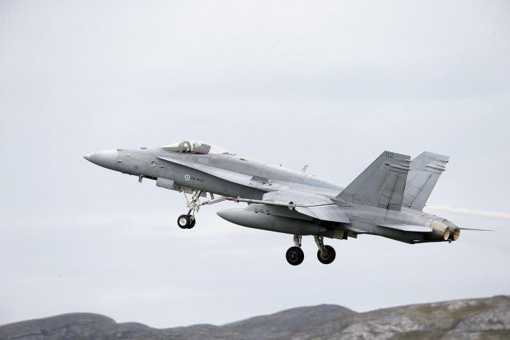 A Finnish F-18 Hornet fighter aircraft departs from Bodø Main Air Station in Norway during the Norwegian-led Exercise 'Arctic Challenge 2015'.