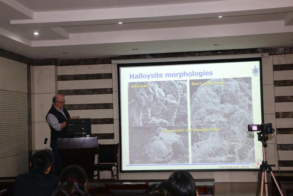 Figure 6. Dr. David Cooke discussing the sample with students during the lecture 6 December 12, 2016. Titled Clay alteration of the Cerro la mine porphyry epithermal prospect, Chiapas, Mexico by Dr.