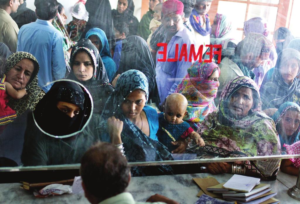 Women and children queue for services at Qasimabad Hospital in Hyderabad, which was one of 928 health facilities assessed by the HSS Component.