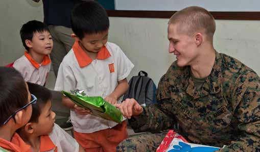 The event was part of a scheduled community service project during the ship s port visit, and Chief Warrant Officer Marc Lefebvre saw the opportunity to bring smiles to children s faces.