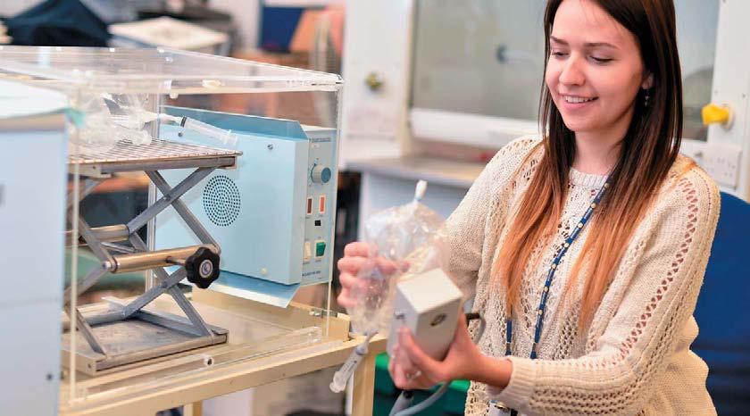 EXCELLENCE AND INNOVATION PhD research student Abigail Rutter using SIFT-MS breath analysis equipment with samples of exhaled breath in bags.