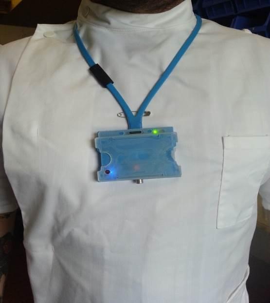 Badge worn by healthcare worker that communicates with other