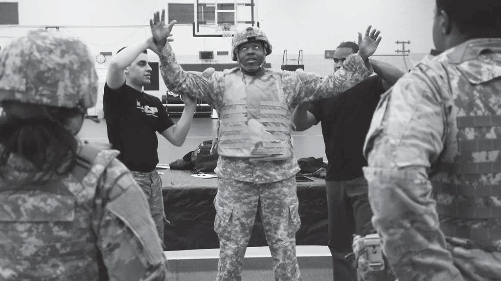 Photos by DEMETRIA MOSLEY Master Combatives Trainers Sgt. Edwin Velazquez, left, and Staff Sgt.