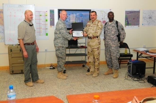 Army Capt Robert Burnham) Right to Left: COL Stanley Brown (MNC-I Comptroller), Staff Colonel Mohammed Rasheed Abbas (IGFC CPOC Director), Lt Col