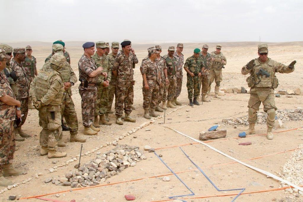 Figure 4 An officer with the 2nd Armored Brigade Combat Team, 1st Armored Division, briefs the concept of the operation prior to the combined arms live fire exercise at the Joint Training Center,