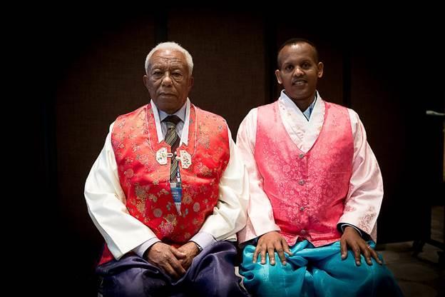 Colonel MelesseTessema Debela from Ethiopia and his son, Endale Meless Tessema, all decked out in Korean hanbok.