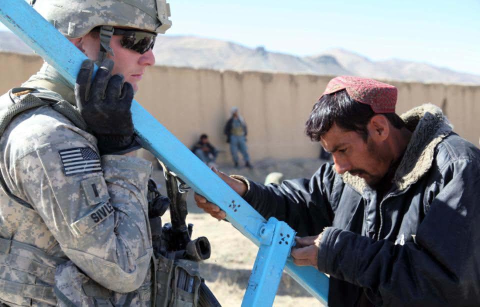 An Afghan National Police officer and U.S. Army 1st Lt.