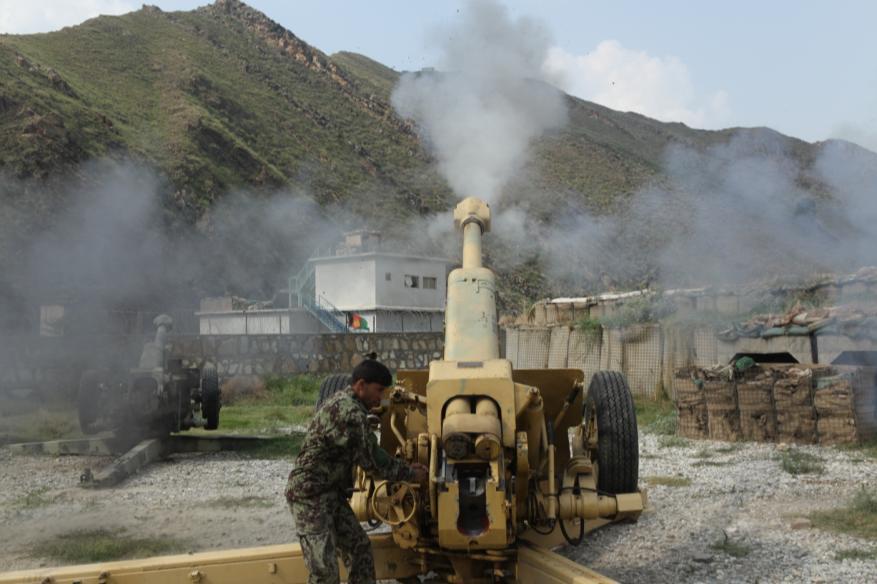 An Afghan soldier fires a 122mm round from a D30 howitzer on the gun line at Nangalam base, Kunar province, Afghanistan, Sept. 11, 2013.