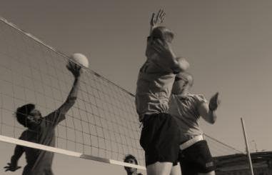 U.S. Army Soldiers jumps to block the volleyball at Forward Operating Base