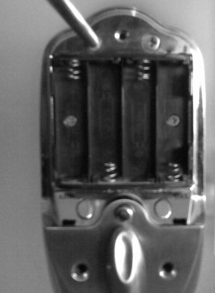 6) Fasten the two shorter (15mm) screws through the