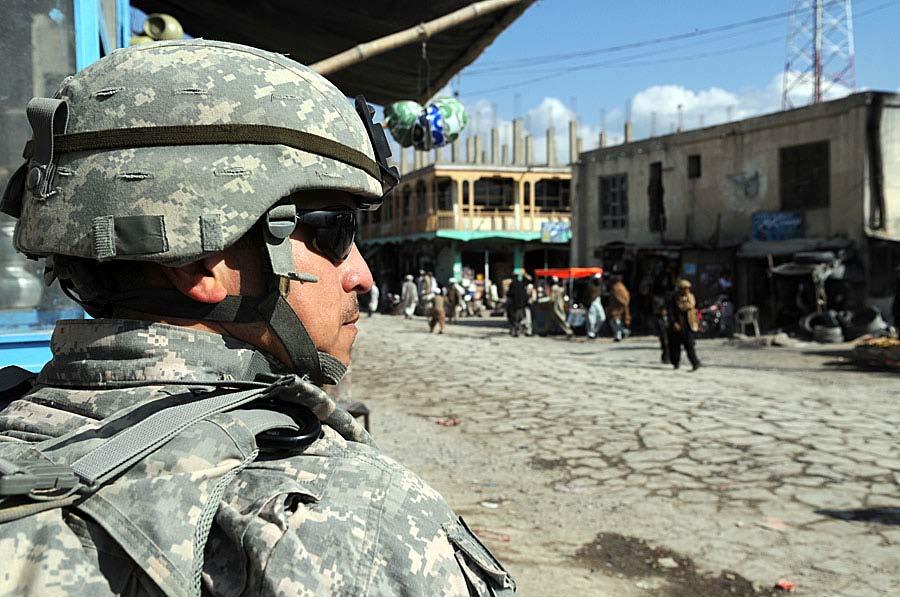 U.S. Navy Chief Petty Officer Gustavo Gonzalez, a provincial reconstruction team Paktika medic, works security on a street in Orgun Afghanistan, Nov. 3, 2009. PRT Paktika is an integrated team of U.S. military and representatives from the U.