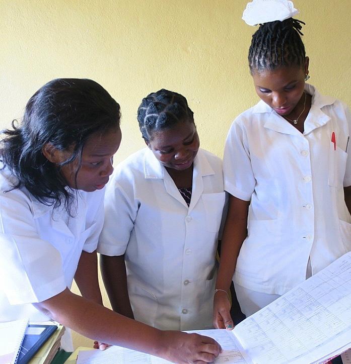 Health staff in Mozambique analyze client data in a