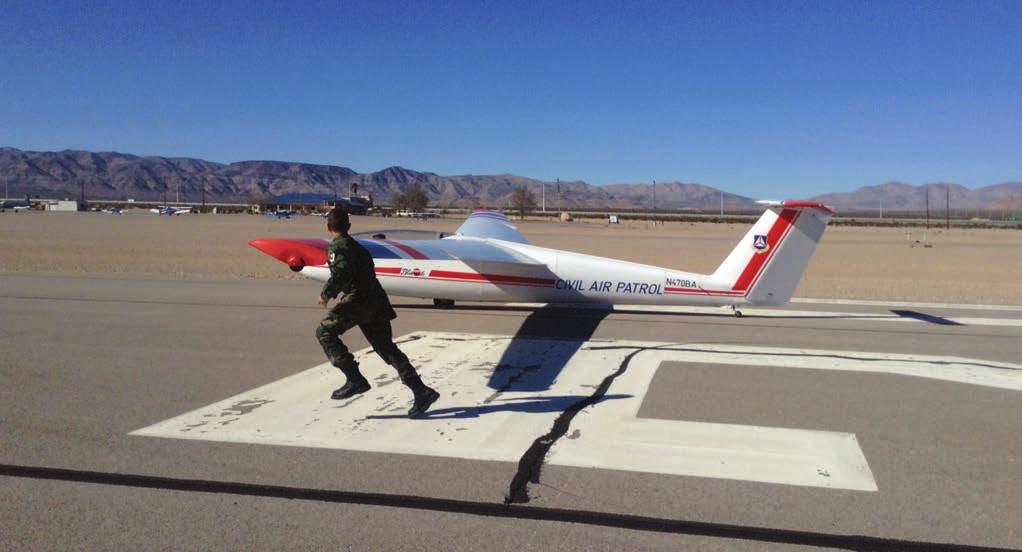 Nevada-Wing_Layout 1 2/6/15 10:14 AM Page 3 A cadet runner participates in Nevada Wing glider operations at Jean Airport.