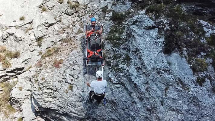 KFOR COMMITTED TO SEARCH AND RESCUE TRAINING rescuers to reach wounded persons from a higher position, lowering a stretcher down a rocky wall, and implementing an emergency ropeway.