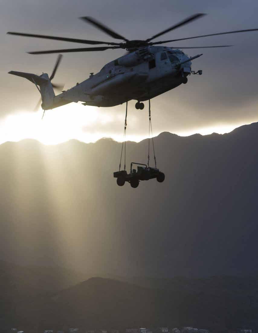 A CH-53E Super Stallion helicopter assigned to Marine Heavy Helicopter Squadron 463 carries a Humvee during an external lift training. (U.S. Navy photo by Lance Cpl.