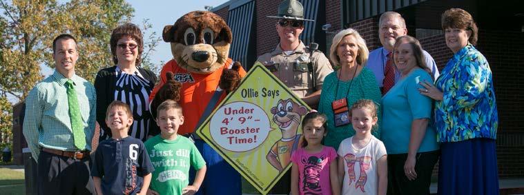 Photo Caption: Ollie Otter with Pickett County. signs, and more were distributed to elementary schools and community venues for each activity.