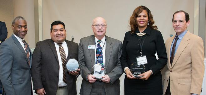DBEFEATURE MoDOT s 2016 Civil Rights Contractor Compliance/DBE Training Symposium ECR Director Lester Woods (left) and MoDOT s Chief Engineer, Ed Hassinger (right) present awards to Carlos Martinez