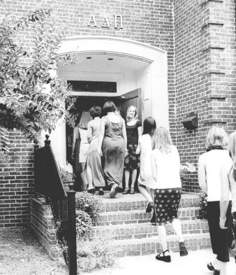 By Daniel Uhlig/ STUDENT PUBLICATIONS A sister greets excited sorority rushees outside of the Alpha Delta Pi house during Sorority
