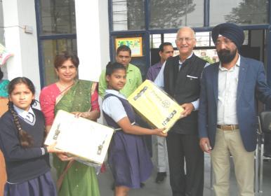 Global Grant Project - Happy School inaugurated Chief Guest PDG Yoginder Diwan handing over the School Bags President Dr.