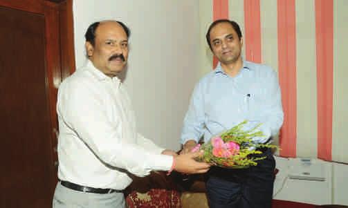 ) Bengaluru and Dr. S. Chandrashekar, President, The Karnataka State Urban Credit Cooperative Societies Federation Ltd., Bengaluru.