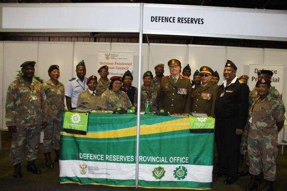 The Exhibition Stall Group photo of Maj Gen Andersen and SCWO Jan Vijioen, Defence Reserves Warrant Officer, with the