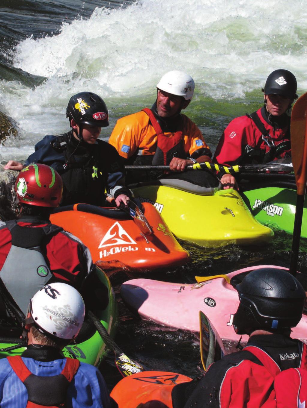 Young kayakers at Cascade s new Kelly s Whitewater Park consult with four-time world freestyle kayak champ Eric