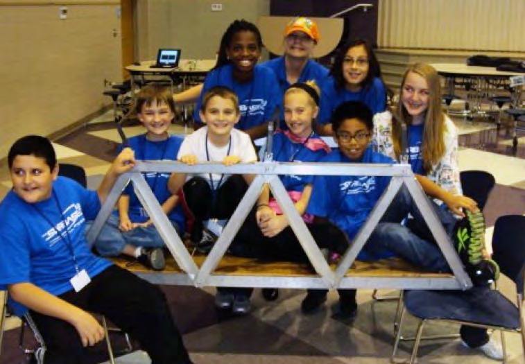 The teams were given background investigations to complete, which included watching a DVD about types of bridges, testing virtual bridges on the computer, building sample bridges out of K Nex, and