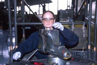 Julie Jewett, with the 355th Component Maintenance Squadron at Davis-Monthan, replaces an auxiliary power unit filter.