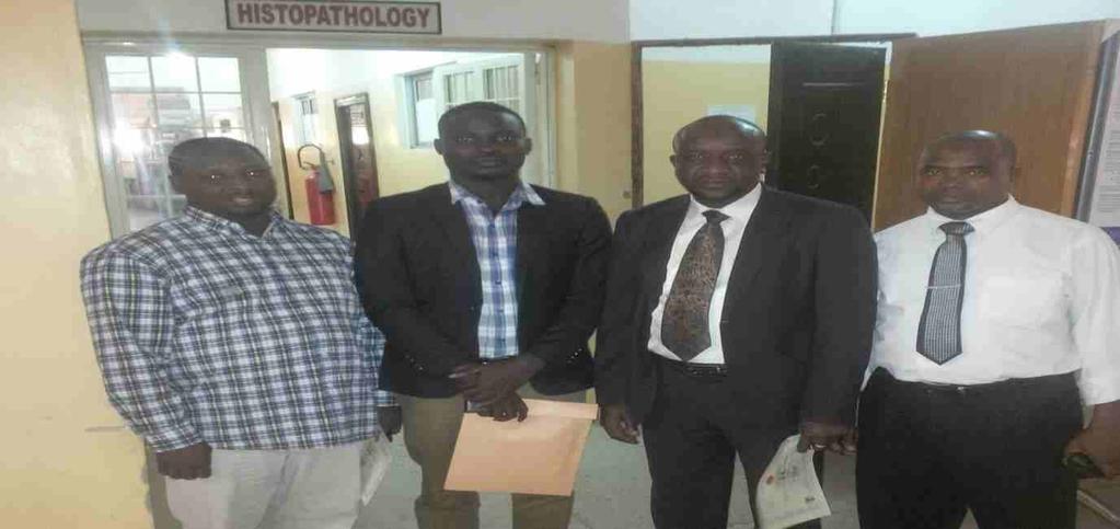 PHOTOGRAPH SHOWING VISITING FMOH TEAM MEMBER AND FTH GOMBE CANCER REGISTRY FROM[L] [R] : SNO