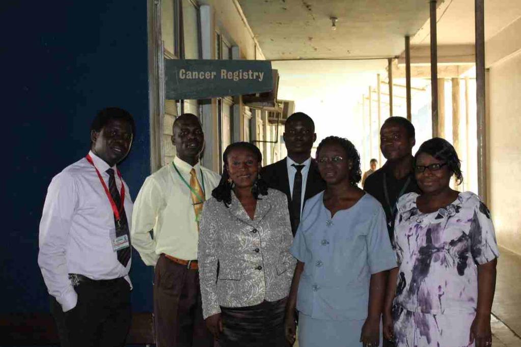 ABOVE PHOTOGRAPH SHOWING IBADAN CANCER REGISTRY STAFF WITH FMOH VISITING TEAM FROM [L] [R] : DR. G. O. OGUN, MR.A.LADIPO, MS ALICE GYANG [NCCP / FMOH], ISAAC BRANTLY[FMOH], MRS.