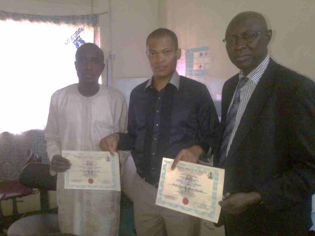 PHOTGRAPH SHOWING UMTH CANCER REGISTRY DIRECTOR AND STAFF TOGETHER WITH VISITING FMOH TEAM