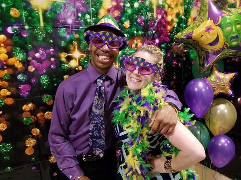 Staff spent weeks after school decorating the gymnasium for the big event, and attendees were astonished to see the transformation; Louisiana style Mardi Gras decorations filled the gym; and students