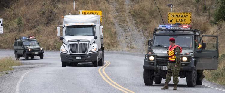 in British Columbia on September 9, 2017. Here, Sgt Jason Moldovan and Cpl Drewe De Boer of 1 MP Pl Edmonton conduct traffic control at Riske Creek BC. Photos by Corporal I.