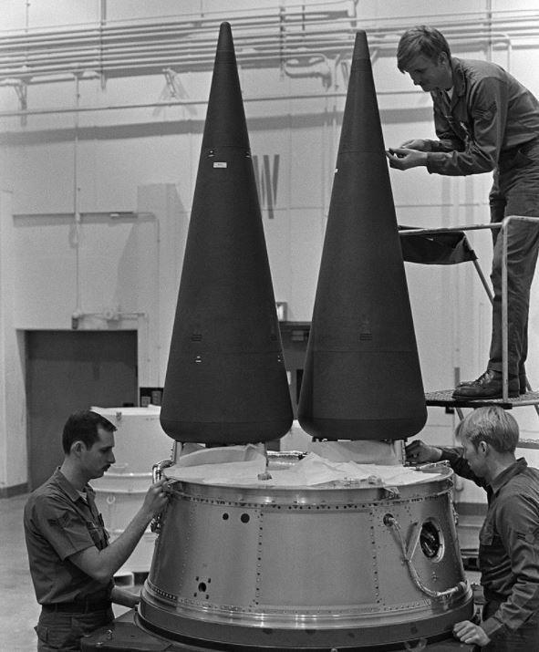 Fig. 2. This shows two low-drag RVs being placed on a Minuteman III missile, which can carry three RVs. (Source: US Air Force).