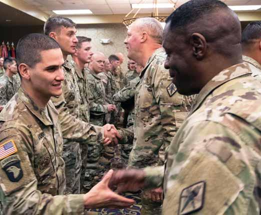 EIB Continued from Page 12 Candidates were tested on their physical prowess, weap- - - Command Sgt. Maj. Lamont Christian, Fort Jackson s senior enlisted leader, shakes the hand of Staff Sgt.