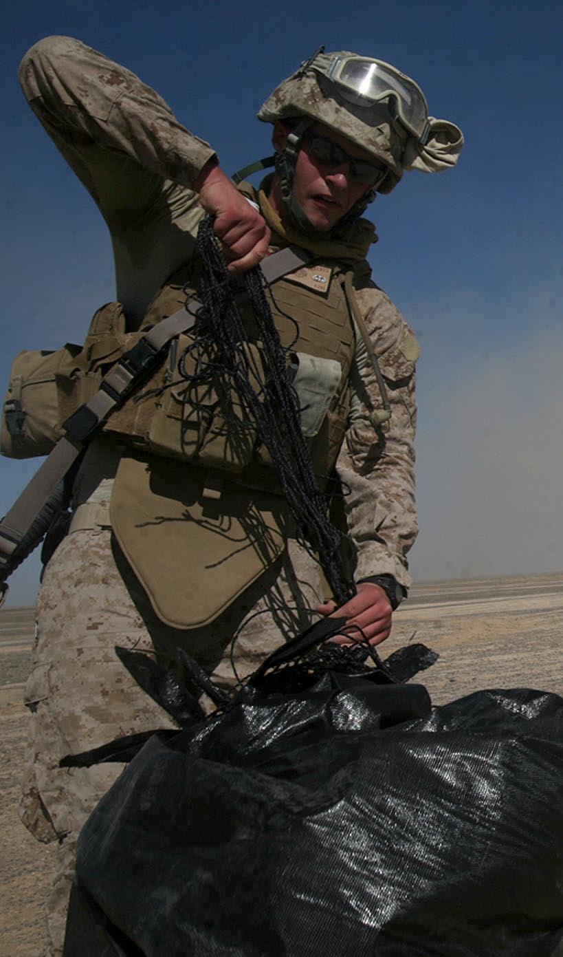 Air delivery Marines get the DROP on new parachute system Air delivery specialists with 1st Marine Logistics Group (Forward) recover Low Cost Low Altitude parachute systems during a